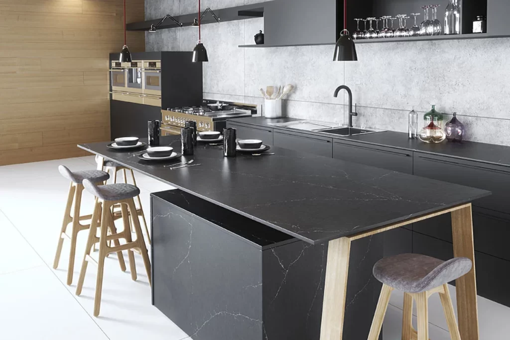 Silestone Eternal Charcoal Soapstone quartz kitchen island installation in Londonderry, NH remodel with charcoal cabinets, seating, and pendant lights