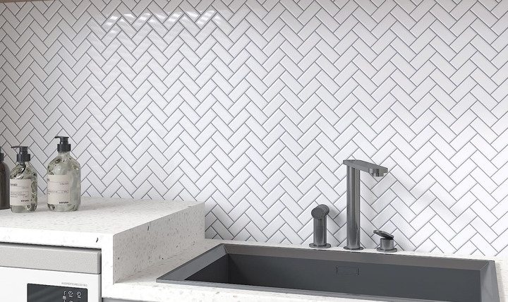 White quartz bathroom countertop with black faucet and basin