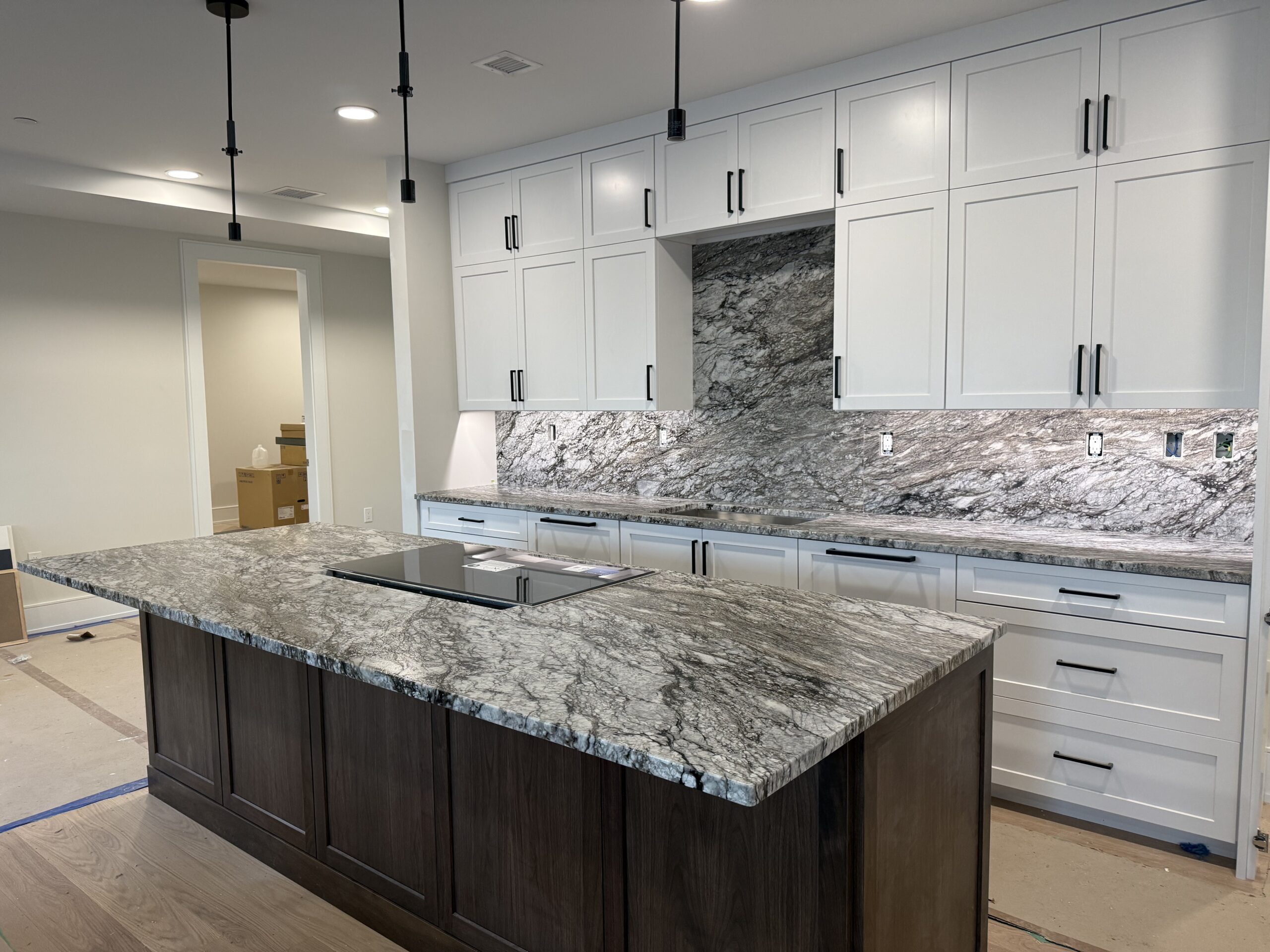 leathered quartzite countertops Sahara Sky installed kitchen warm stone tones