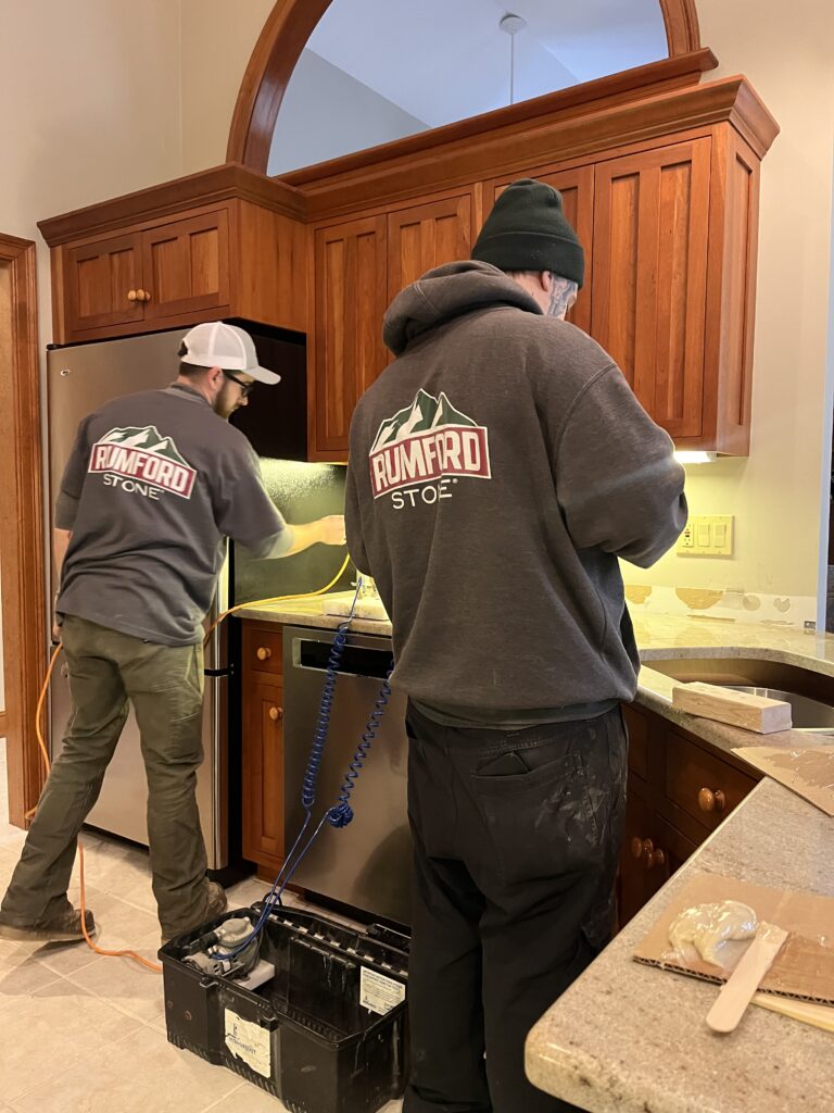 Astoria granite countertops installation process Concord NH Rumford Stone team setting slab