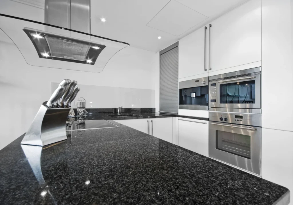leathered granite countertops Black Pearl close-up matte texture Rumford Stone NH showroom