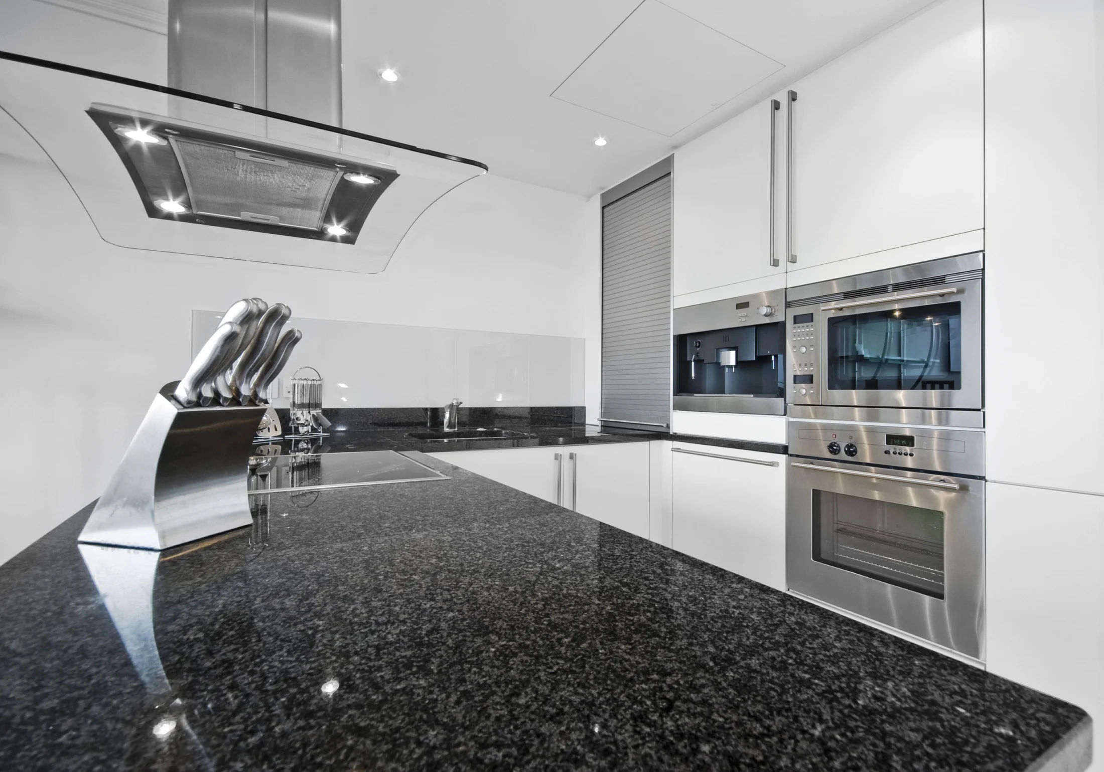 leathered granite countertops Black Pearl close-up matte texture Rumford Stone NH showroom