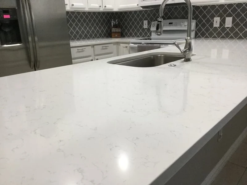 Carrera Trenita Viatera Viatera quartz bright white subtle gray veining Rumford Stone showroom